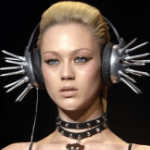 Model with pointy metal headphones