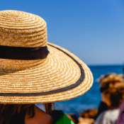 Woman with sun hat on a beach